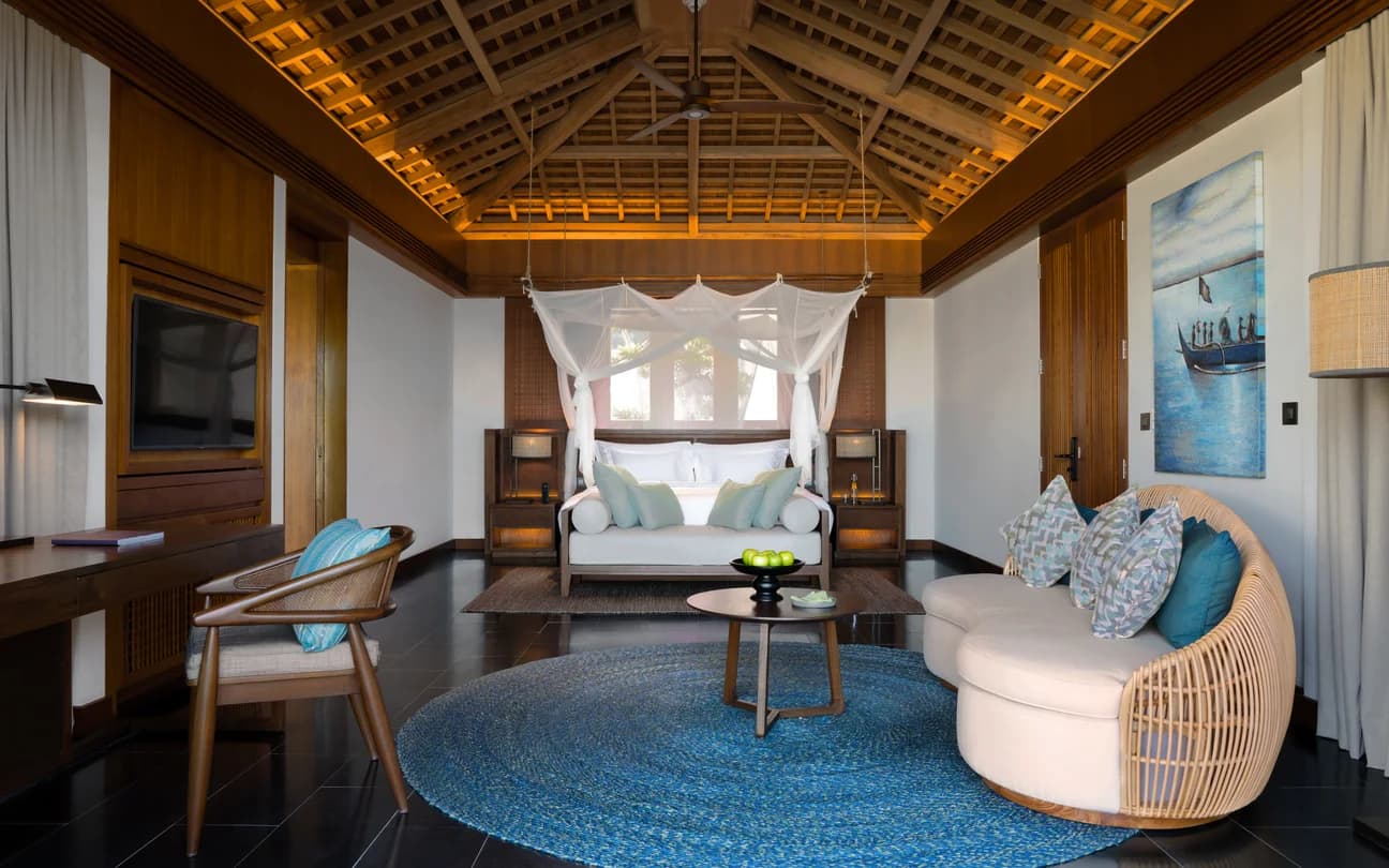 Luxury villa bedroom with canopy bed and ocean-inspired decor